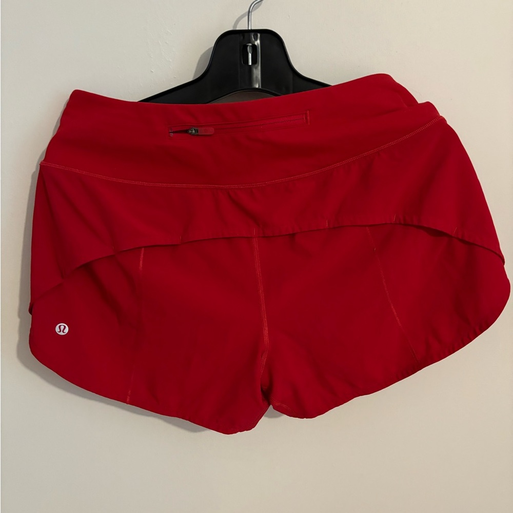 Red running shorts size 8